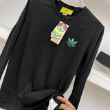 Front view of Gucci luxury clothing with logo-detail design