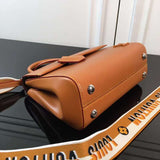 Close-up detail of modern classic women's handbag – women's designer-style accessory