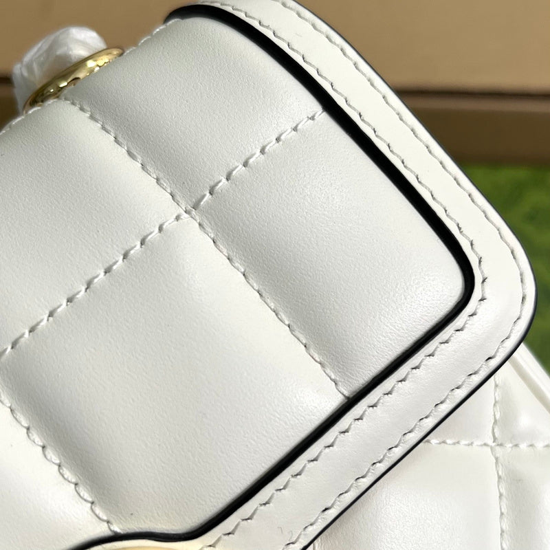 Side profile of classic polished women's handbag – women's statement bag