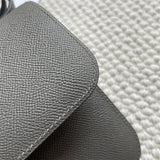 Side view of poised structured handbag