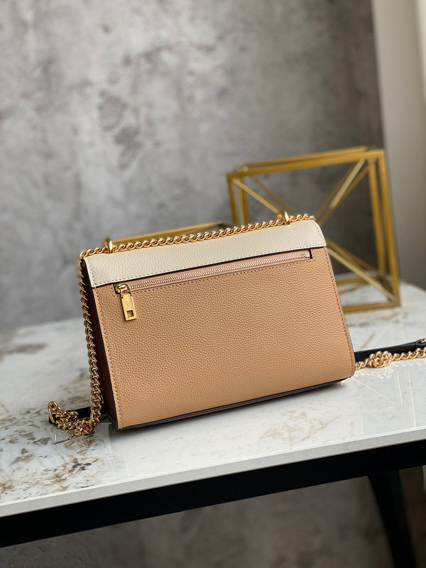 Styled lifestyle shot of refined structured women's handbag – women's luxury accessory