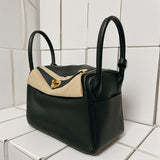 Contemporary satchel carried on shoulder