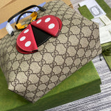 Styled lifestyle shot of statement modern women's handbag – women's luxury handbag