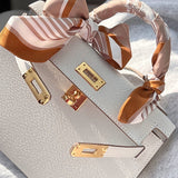 Side view of sophisticated structured handbag