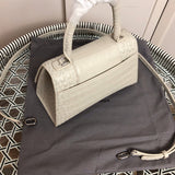 Handle and strap detail of modern polished women's handbag – women's designer-style accessory