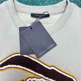 Close-up detail shot of Louis Vuitton luxury clothing with monogram-inspired silhouette