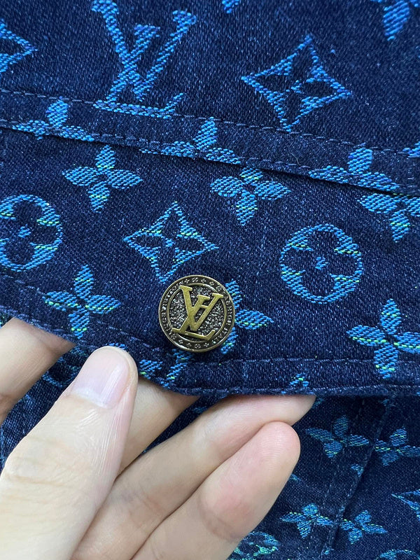 Flat lay presentation of Louis Vuitton luxury clothing with label-forward styling