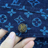Flat lay presentation of Louis Vuitton luxury clothing with label-forward styling