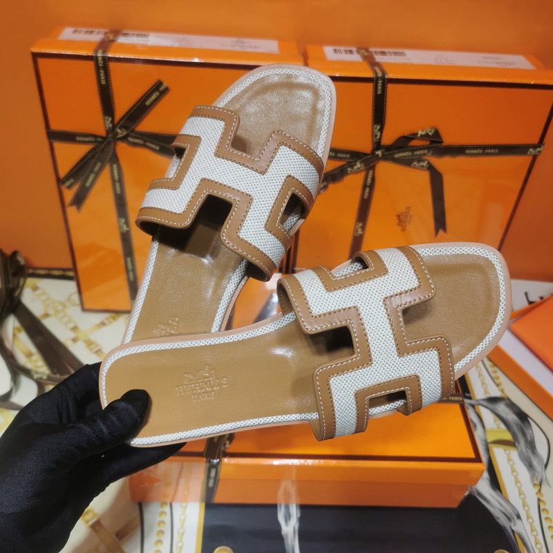 Hermès Chocolate Brown Slide Sandals - Angled View