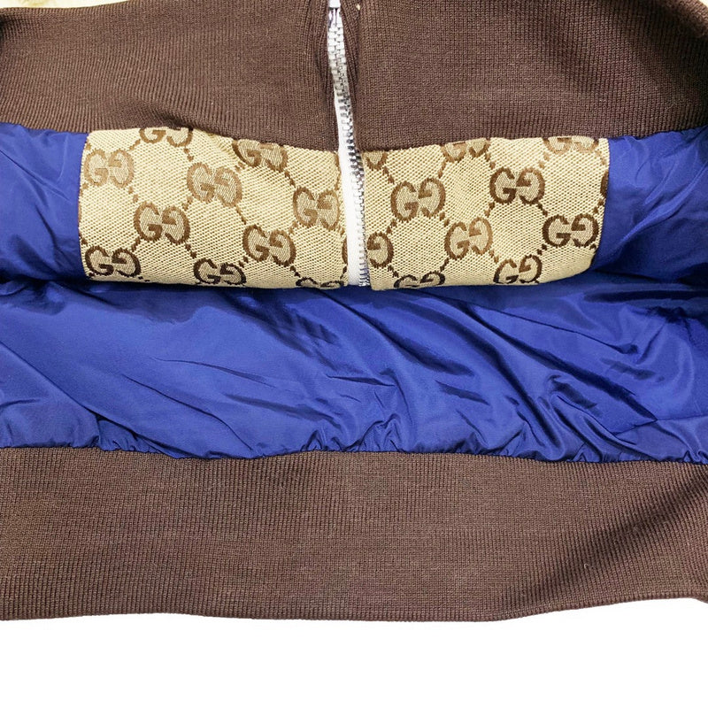 Side profile of Gucci luxury clothing with label-forward styling