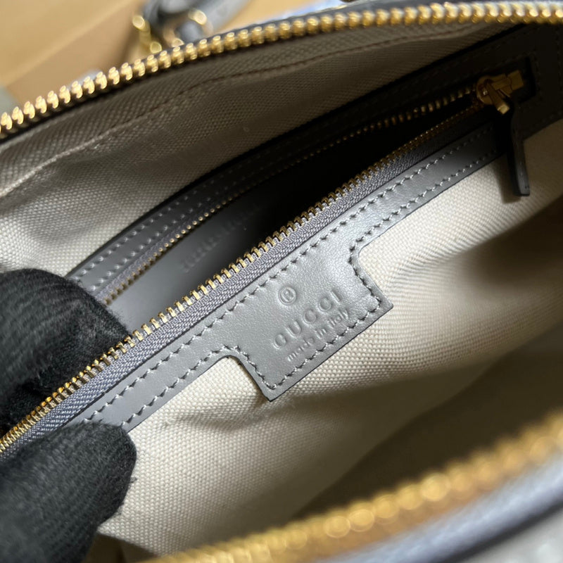 Side profile of elevated polished women's handbag – women's designer-style accessory