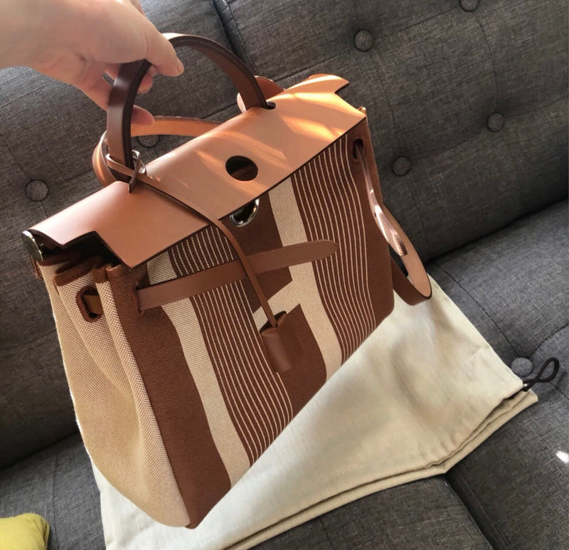 Side view of polished structured handbag