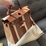 Side view of polished structured handbag