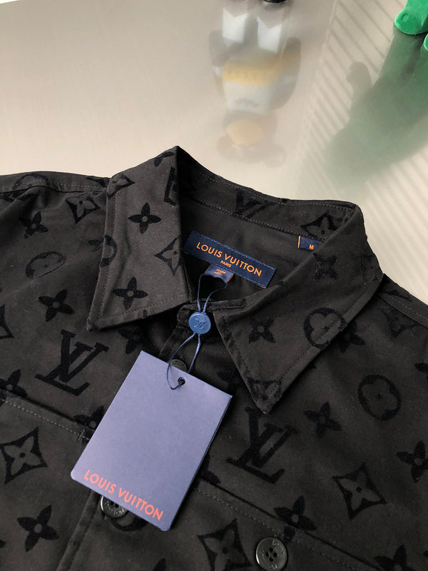 Close-up detail shot of Louis Vuitton luxury clothing with signature branding