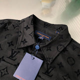 Close-up detail shot of Louis Vuitton luxury clothing with signature branding