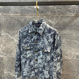 Close-up detail shot of Louis Vuitton luxury clothing with logo-detail design