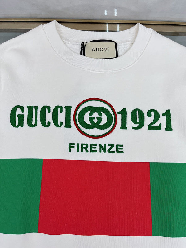 Full styled look of Gucci luxury clothing with monogram-inspired silhouette