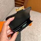 Side view of polished structured handbag