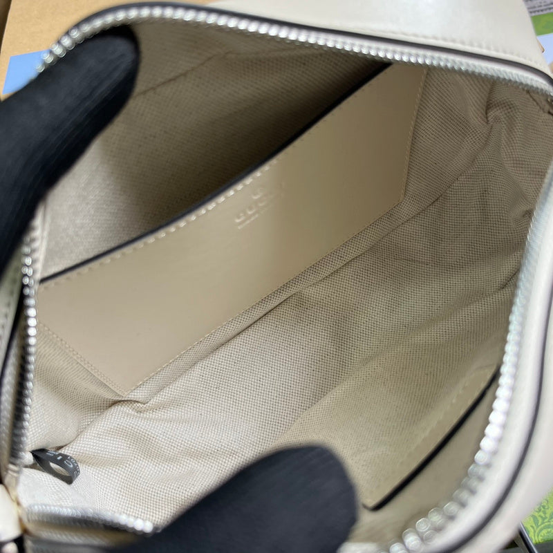Side profile of sleek structured women's handbag – women's luxury accessory