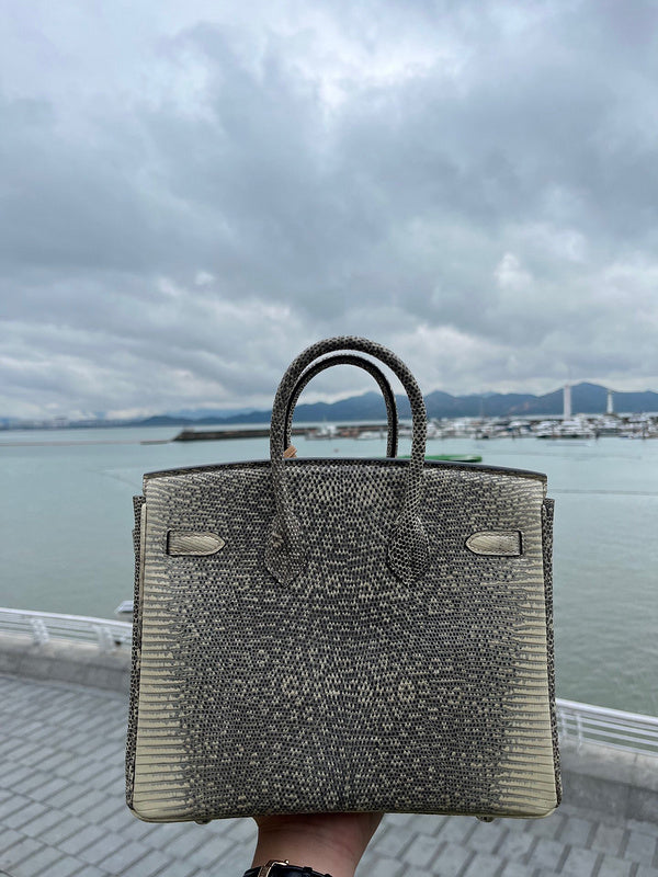 Side view of poised structured handbag