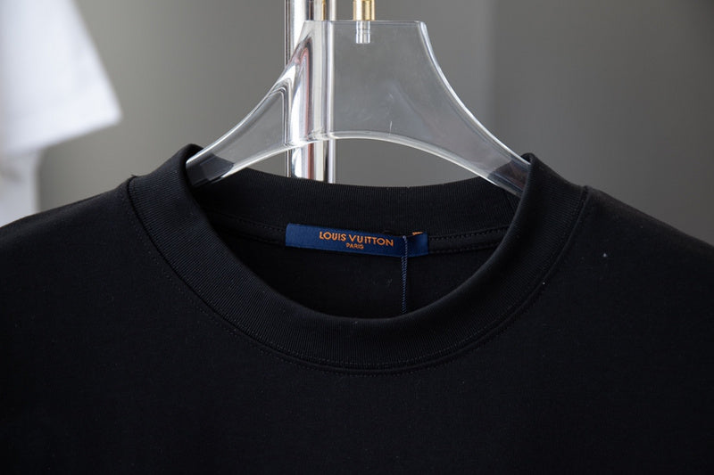 Close-up detail shot of Louis Vuitton cotton t-shirt with signature branding