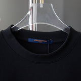 Close-up detail shot of Louis Vuitton cotton t-shirt with signature branding