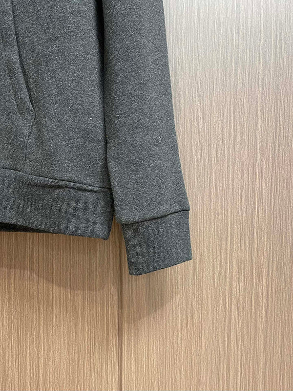 Side profile of Louis Vuitton luxury clothing with signature branding