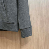 Side profile of Louis Vuitton luxury clothing with signature branding