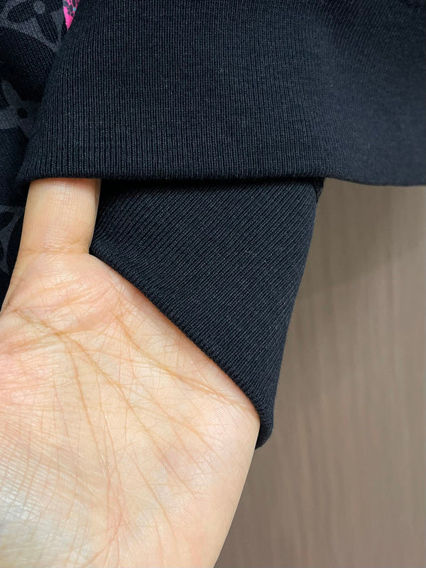 Close-up detail shot of Louis Vuitton luxury clothing with relaxed-fit cut