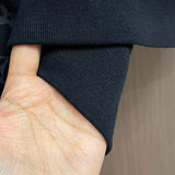 Close-up detail shot of Louis Vuitton luxury clothing with relaxed-fit cut