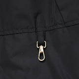 Close-up detail shot of Louis Vuitton luxury clothing with monogram-inspired silhouette