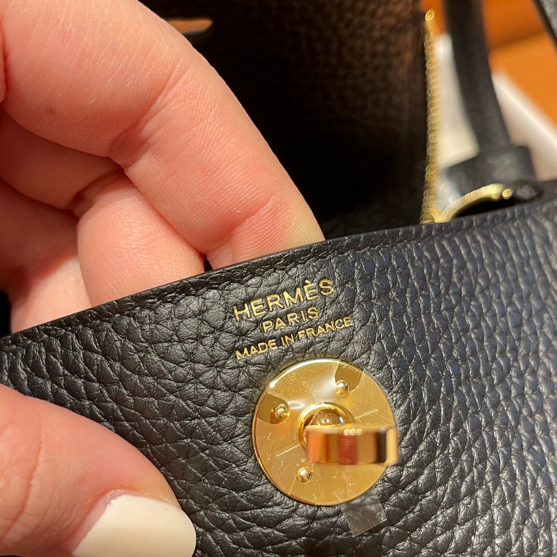 Side view of poised structured handbag
