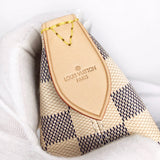 Side profile of signature polished women's handbag – women's everyday handbag