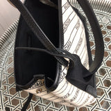 Styled lifestyle shot of refined chic women's handbag – women's luxury handbag