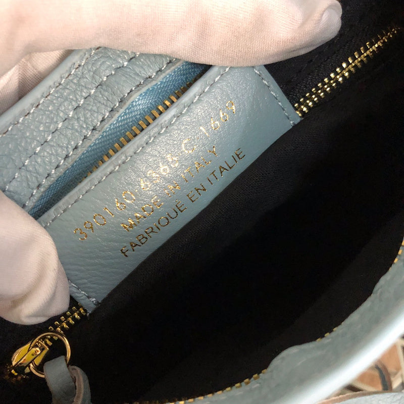Side profile of structured everyday-luxe women's handbag – women's designer-style accessory