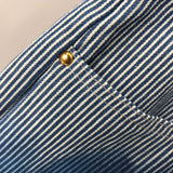 Flat lay presentation of Louis Vuitton luxury clothing with logo-detail design