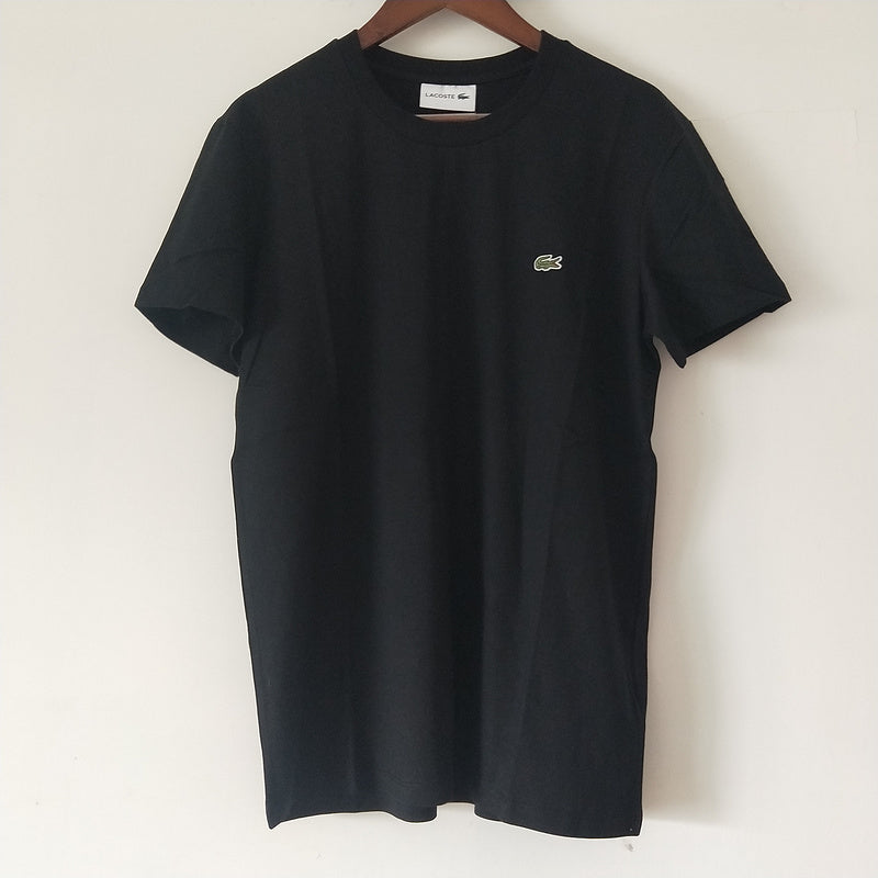 Flat lay presentation of Lacoste luxury clothing with logo-detail design