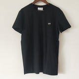Flat lay presentation of Lacoste luxury clothing with logo-detail design
