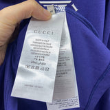 Front view of Gucci luxury clothing with logo-detail design