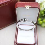 Front view of Cartier unisex jewelry piece
