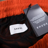 Close-up detail shot of Rhude luxury clothing with monogram-inspired silhouette