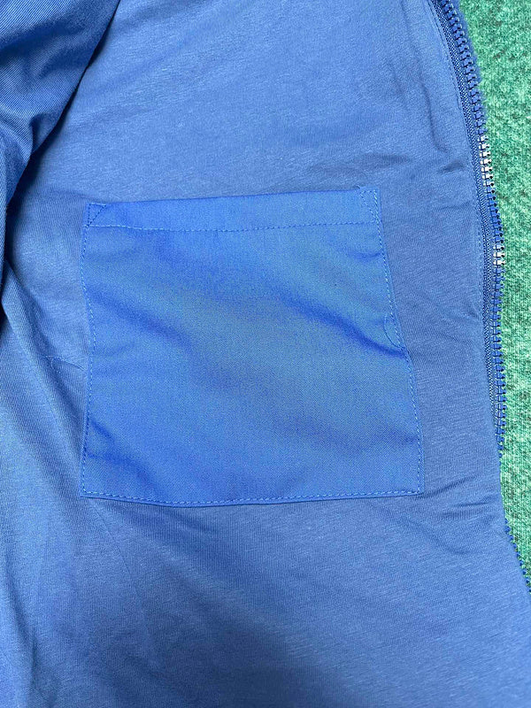 Side profile of Louis Vuitton luxury clothing with logo-detail design