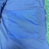Side profile of Louis Vuitton luxury clothing with logo-detail design