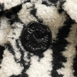 Flat lay presentation of Louis Vuitton luxury clothing with logo-detail design