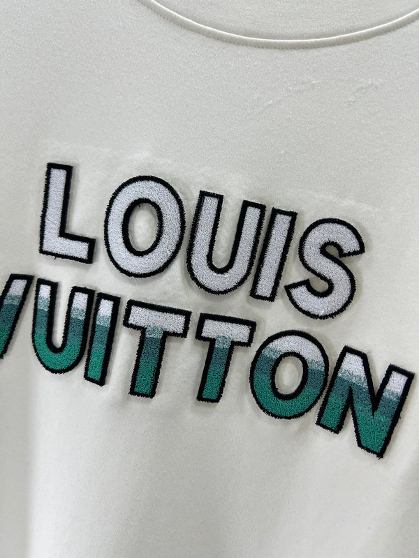 Flat lay presentation of Louis Vuitton luxury clothing with monogram-inspired silhouette