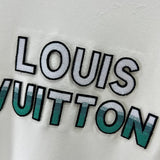 Flat lay presentation of Louis Vuitton luxury clothing with monogram-inspired silhouette