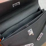 Side view of poised structured handbag