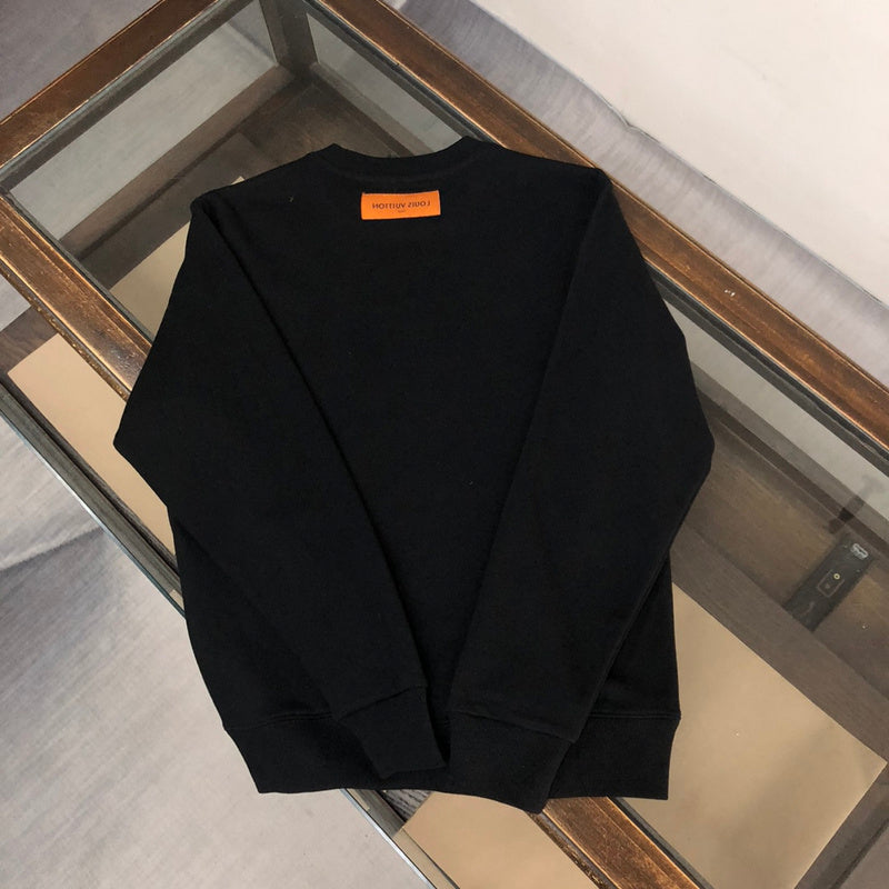 Close-up detail shot of Louis Vuitton luxury clothing with relaxed-fit cut