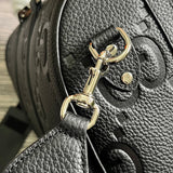 Styled lifestyle shot of elevated refined women's handbag – women's luxury accessory