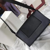 Styled lifestyle shot of statement refined women's handbag – women's luxury accessory